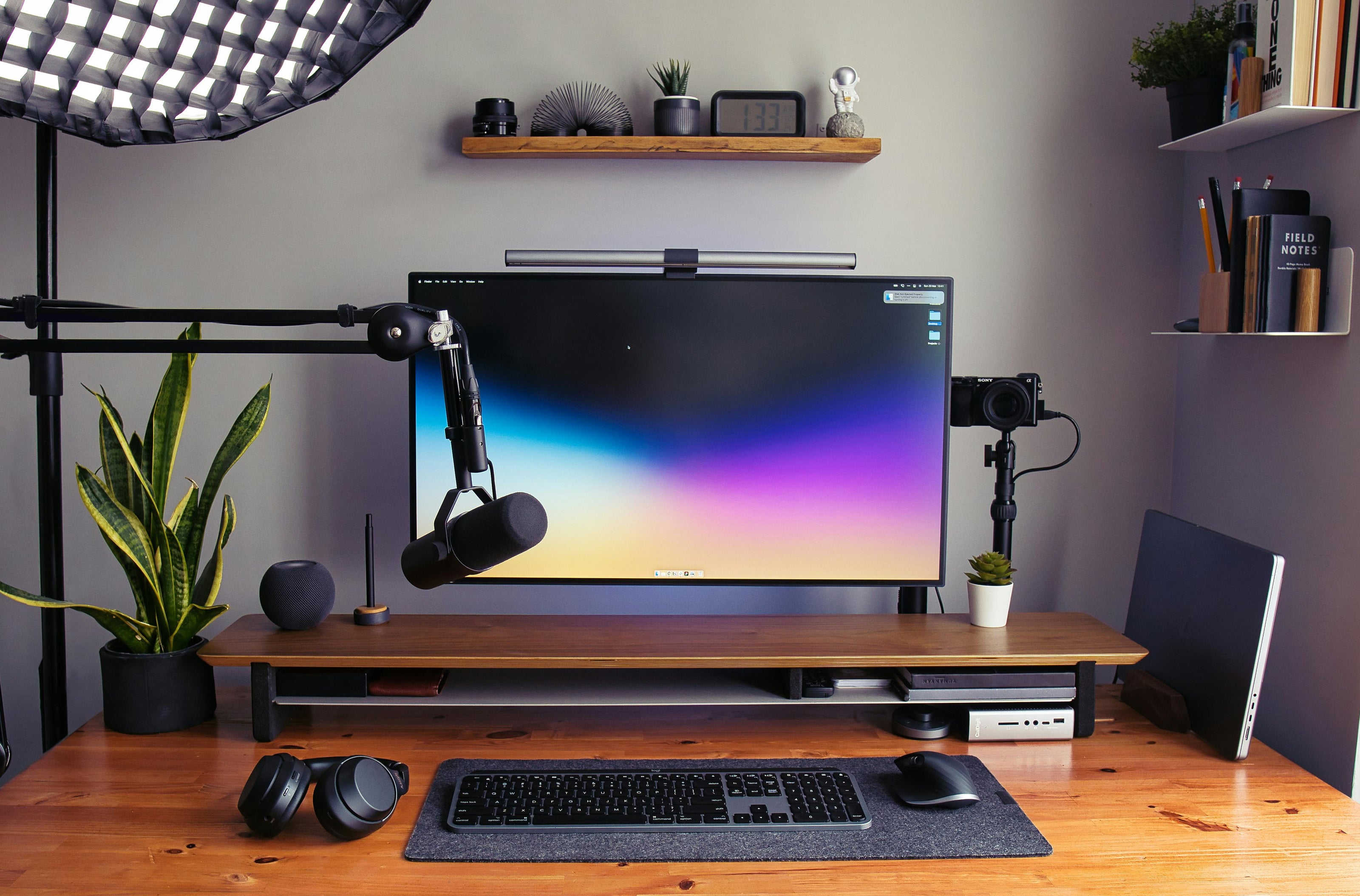 Vibrant RGB desk setup showing LumeScape Light Bar with multicolor ambient lighting effect.