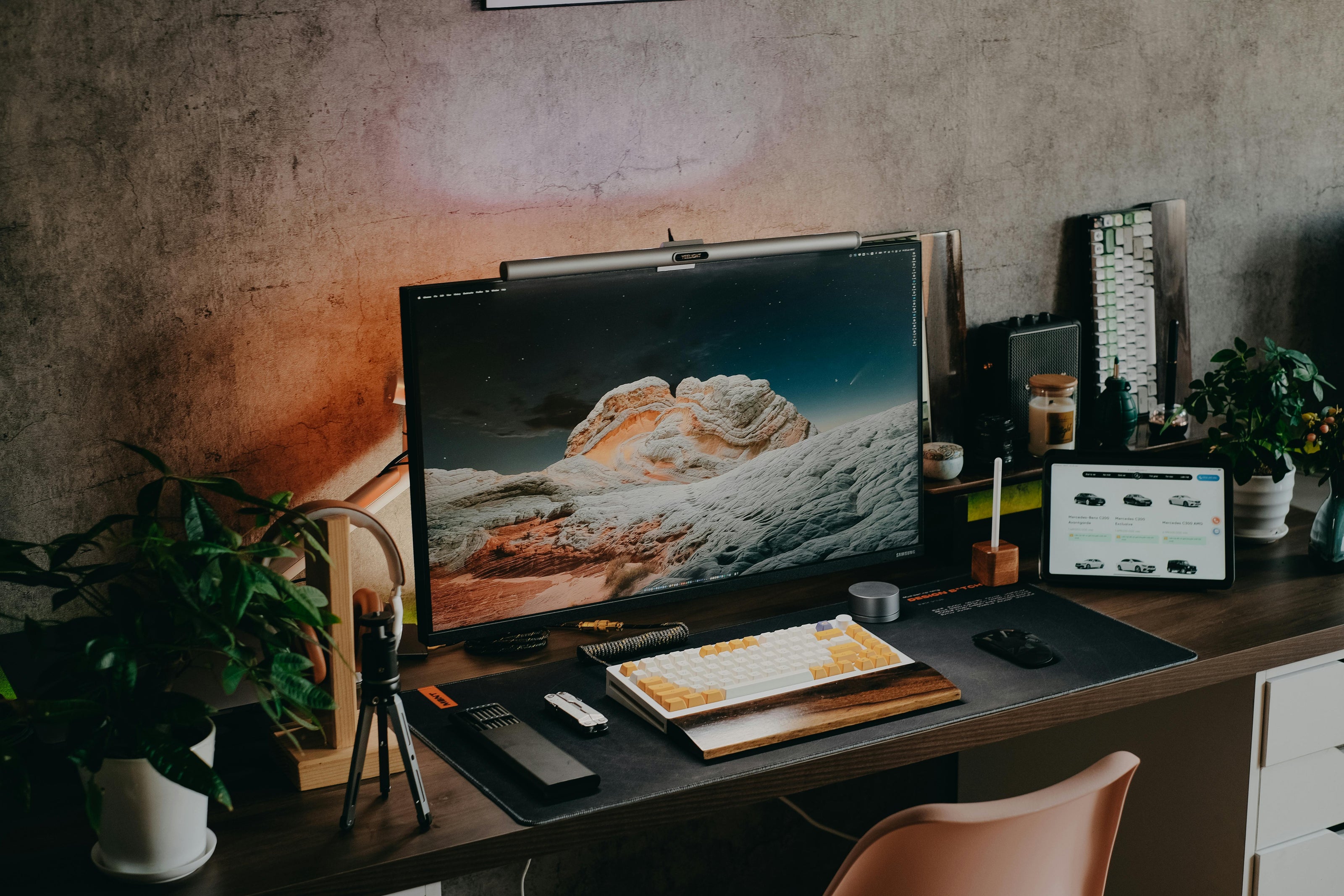 Content creator workspace lit by the LumeScape Monitor Light Bar in warm white mode for eye comfort.